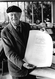 At home in Big Sur, showing his Nobel Peace Prize certificate, 1987